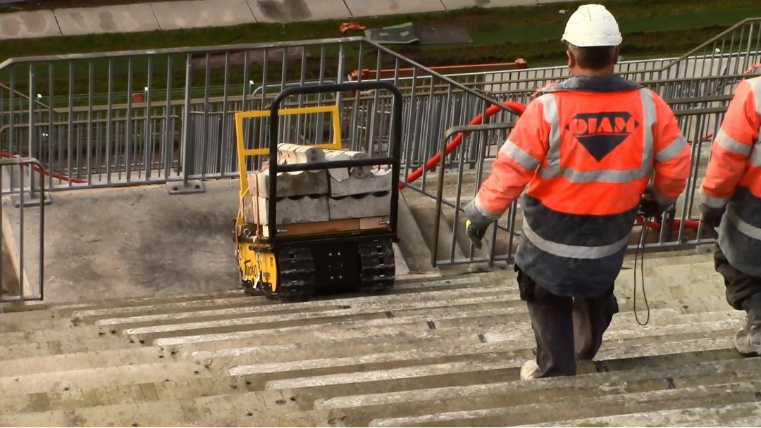 Stair climbing robot in a stadium