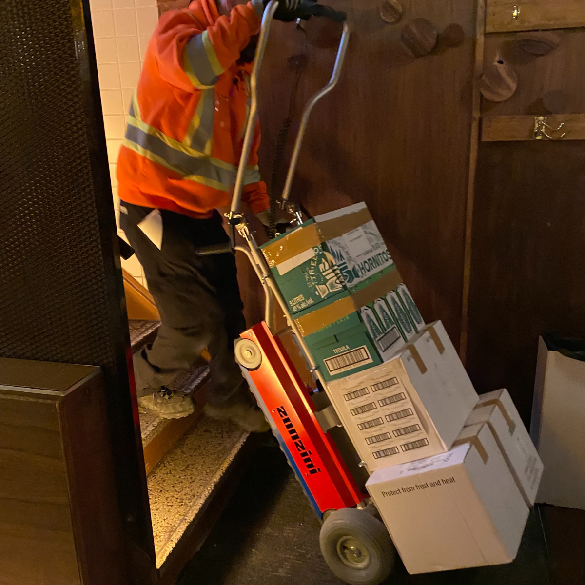 Stair dolly moving boxes in basement